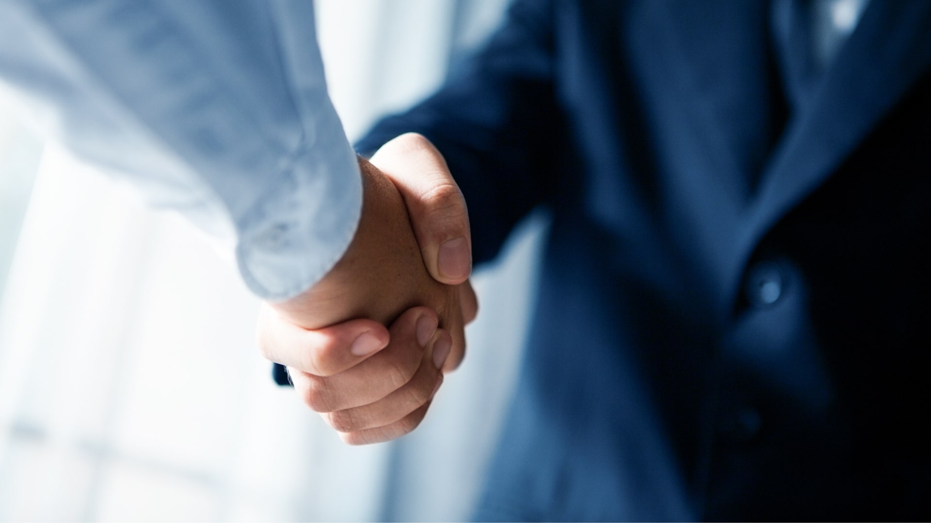 Men shaking hands post aircraft acquisition counseling services by My Jet Private Air Travel